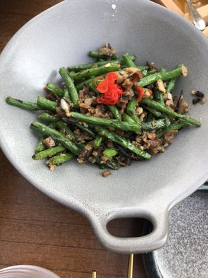French beans, mushrooms and olives   at Tàn Chá Restaurant  in Dubai