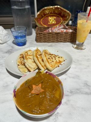 Mixed vegetables curry (vegan) with mango lassi and cheese garlic naan (vegetarian).  at Jyoti in Sapporo