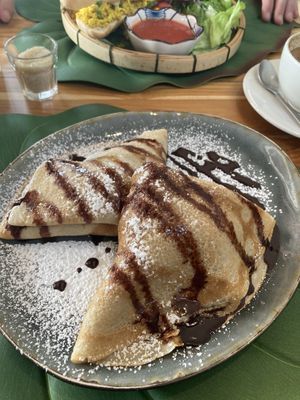 Banana , peanut butter and chocolate pancakes   at The Happy Cat - Veggie Cafe-Restaurant in Luang Prabang