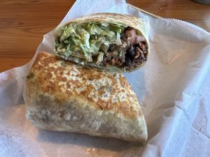 Veganzilla Burrito- Vegan beef, lettuce, tomatoes, vegan cheese, guacamole, and black beans  at Solazo in Jacksonville