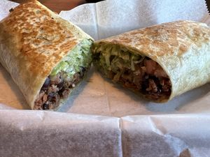 Veganzilla Burrito- Vegan beef, lettuce, tomatoes, vegan cheese, guacamole, and black beans  at Solazo in Jacksonville