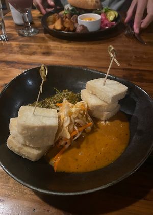 the tofu skewers! in the back is the veggie burger- also vegan without the cheese  at Bandaloop in Arundel