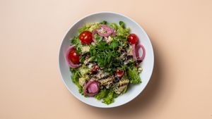Oumph salad, pickled red onions, confit cooked cheery tomatoes, nuts and sorrel pesto at Fröken Selfoss in Selfoss