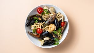 Seafood pasta, we also offer an vegan pasta alternitive, with hearty plum tomatoes sauce, capers, olives and oumph! at Fröken Selfoss in Selfoss