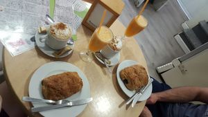 Breakfast with soya milk Cappuccino, fresh orange juice and pain au chocolat at Tres Semillas in Alicante