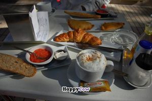 Cappuccino, toasts with *cheese* and tomato, croissant. at Tres Semillas in Alicante