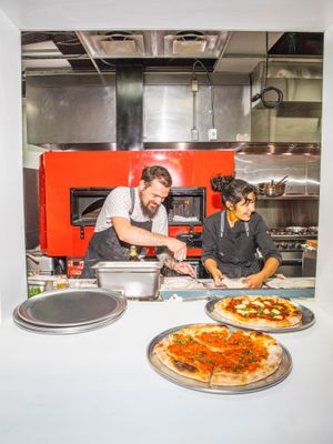 featuring seasonal produce sourced from local farms at Everyday Pizza in Denver