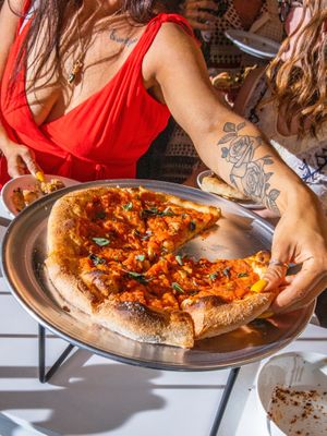heirloom tomato pizza w charred tomatoes, oregano and chili at Everyday Pizza in Denver