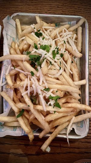 GARLIC PARMESAN FRIES 🍟 
Crispy fries, roasted garlic, fresh parsley, vegan, parmesan , fried garlic  at Golden Road Brewing - West Glendale in Los Angeles