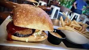 SPICY EGGPLANT 
Fried eggplant, vegan slaw, dill pickle chips, spicy jalapeno BBQ sauce, sriracha aioli with shoestring fries  at Golden Road Brewing - West Glendale in Los Angeles