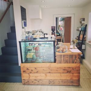 Deli counter. Lots of plastic-free deli goods - humous, olives, tapenade, pastries and cakes. at Grow Green Deli + Eatery in Huddersfield