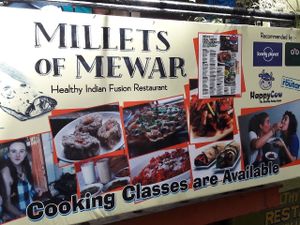 front sign with Happy Cow icon at Millets of Mewar in Udaipur