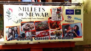 At the entrance. Note the mentioning of "Happy Cow"! at Millets of Mewar in Udaipur