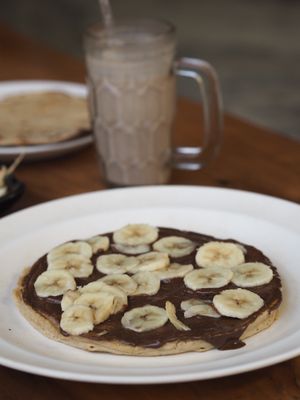 Vegan banana-nutella pancakes  at Millets of Mewar in Udaipur