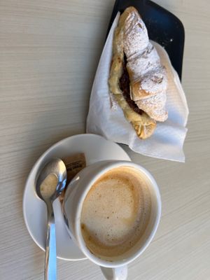 Oat milk latte and chocolate croissant  at Santa Vegana in Barcelona