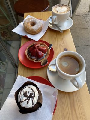 Insanely delicious coffee. Divine chocolate donut. + chocolate muffin and a thing I don't know what to call. All soooooo tasty!  at Santa Vegana in Barcelona