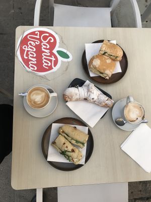 Bocata de no atún y el otro de jamón y queso vegetal. Croissant relleno de chocolate. Café con leche de soja. Todo riquísimo! Todo 13€  at Santa Vegana in Barcelona