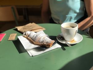 Chocolate croissant and coffee (we are the ones who spilled the coffee, it didn’t come like that)  at Santa Vegana in Barcelona