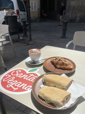 Vegan tuna with tomato sandwitch, pistache creame croissant, oatmilk cap.  at Santa Vegana in Barcelona