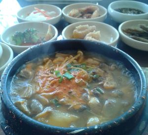 mushroom tofu soup with unlimited sides at Sura Korean BBQ & Tofu House in Long Beach