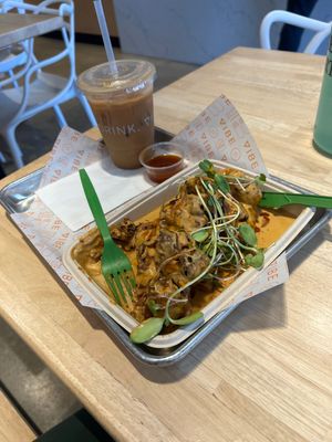 Chicken & waffles with a cold brew & coconut milk    at Vibe Organic Kitchen & Juice in Costa Mesa