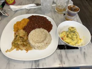 Red beans, coconut rice, sautéed veggies, mashed pumpkin, and potato salad  at Soca Vegan Kitchen in Augusta