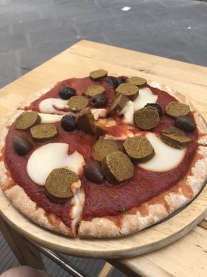 Pizza with sausage  at Vegan Come Koala in Pisa