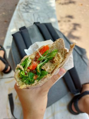 Custom piadini. Whole wheat dough, seitan, vegan cheese, pesto with veggies and olives. SO GOOD! at Vegan Come Koala in Pisa