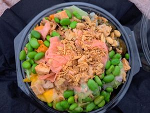 Avocado, mango, tofu, red onion, edamame, rice and salad mix (recommend rather than just rice, it's an awful lot) jalapeños and sweet potatoes, topped with crispy onions, pickled  at Hawaiian Poke Bowl in Bruges