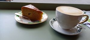 Oat latte and apple cake whilst watching the world go by at Solar Sisters in Guildford