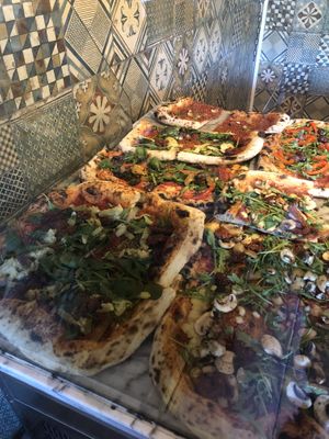 Vegan pizzas by slice   at Nini e Pettirosso in Berlin