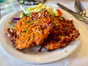 
Onion Bhaji  £4.95

Onions & vegetables mixed with herbs & spices, deep fried
 at Prince Of India  in Isle Of Skye
