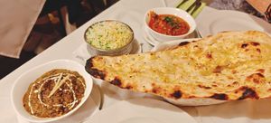 Pilau Rice, garlic Naan, palak paneer and tadka daal. at Everest Spice in Fuerteventura