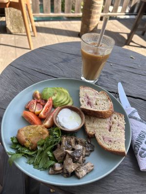 The big breakfast plate - vegan version and an iced latte with oat milk  at Little Ripper Cafe in Tabanan