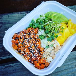 Plant-based Buddha Bowl: Teriyaki sweet potatoes, avocado, pineapple, roasted almond slices, roasted corn, daikon sprouts, green onion, jasmine rice. So healthy and delicious! 💕 at Native Foods in Costa Mesa