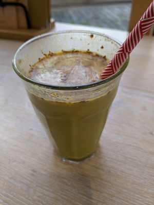 Coconut drink w tumeric, ginger, cinnamon, cardamon, vanills & peppet: 4.60€ at Bagels & Beans - Waterlooplein in Amsterdam