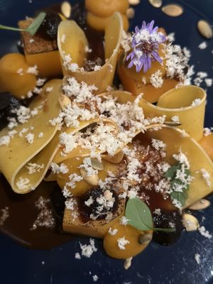 Many ways Pumpkin with edible flower, roasted seeds and finely grated horseradish  at ansvar - Greenery Lab in Copenhagen