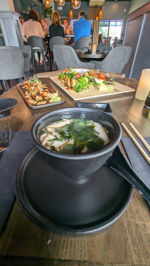 Miso soup on the foreground at Nori in Austin