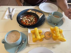 Polenta sticks and vegan shakshouka  at Antù in Lisbon