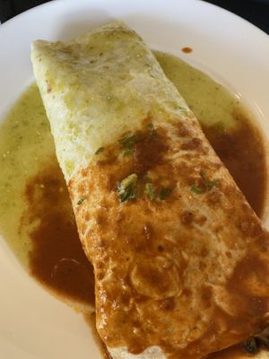 Veggie burrito without cheese or queso. Inside was a ton of veggies, black beans, rice, and lettuce    at Santo Coyote Mexican Food & Tequila Bar in North Little Rock