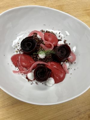 Beet Roses: beet emulsion, beet-pistachio crumble, vegan feta, pickled red onion    at Foglia in Bristol
