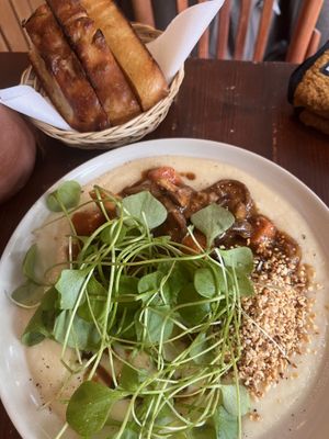 Parsnip crème with shiitake stew and sourdough bread on the sidee  at Bird Flower in The Hague