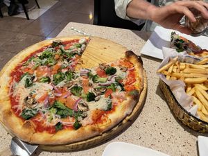 Large veggie pizza and a basket of fries  at Roman's Pizza House in Cape May
