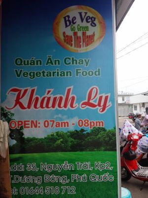 banner at the end of the street with opening hours at Khanh Ly Vegetarian Food in Phu Quoc
