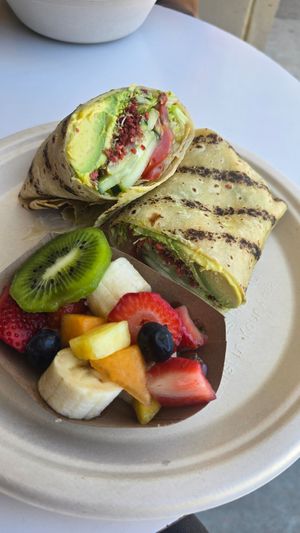 Gluten-free avocado wrap (with crunchy vegan bacon bits) with a side of fresh fruit at Jan's Health Bar in Huntington Beach