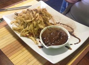 Raw batter balls filled with fresh plum with sweet sauce at BEMBA rawfood & plant-based in Bratislava