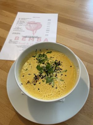 Raw coconut soup (coconut, miso, ginger, pepper, carrot, zucchini, cilantro, chilli, mushrooms)  at BEMBA rawfood & plant-based in Bratislava