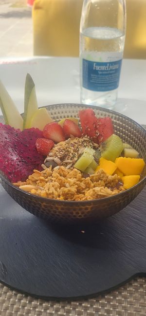 Amazing food, acai bowl with fruit followed by the best vegan ice cream we have ever tasted. at Oops Bubble Waffle Cafè in Tenerife