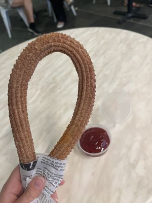 cinnamon sugar churro with raspberry jam  at Churro Time in Cairns