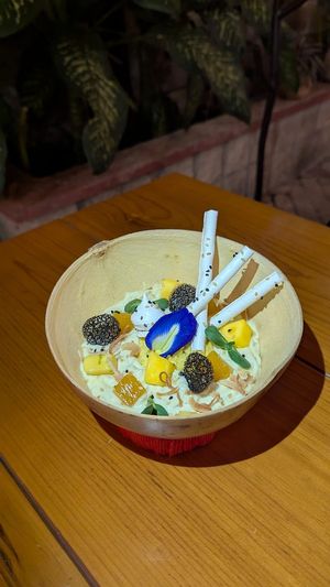 sticky rice, creamy Japanese rice with coconut sauce, fresh mango, passion fruit gel. at WahBao in Merida